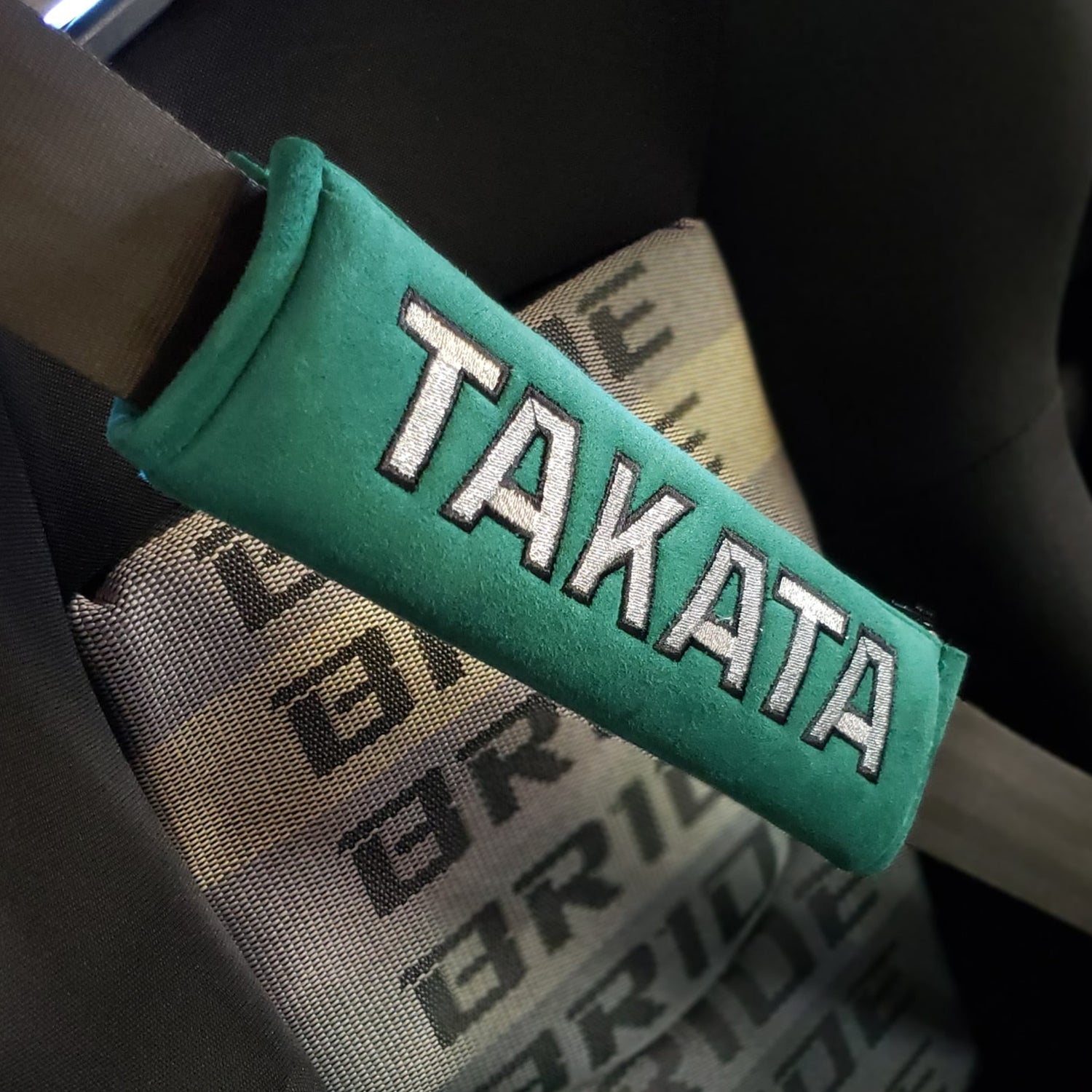 Tkt seat belt shoulder pads installed in car.