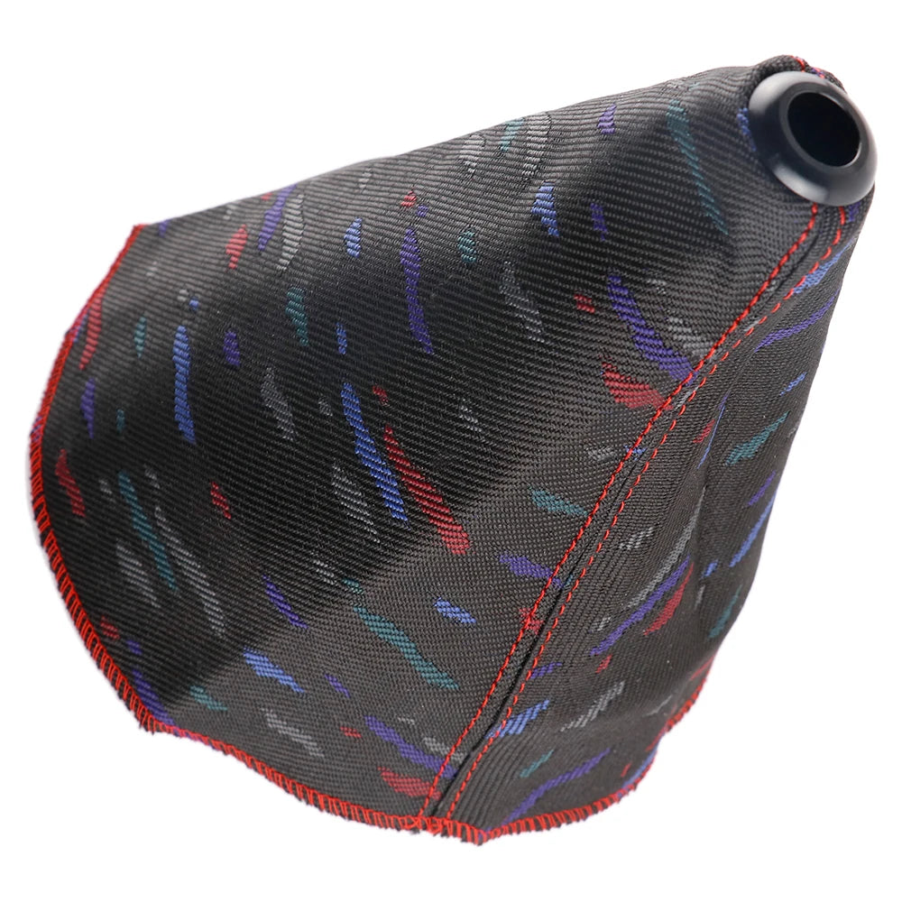 Textured gear shift cover with colorful pattern on a white background