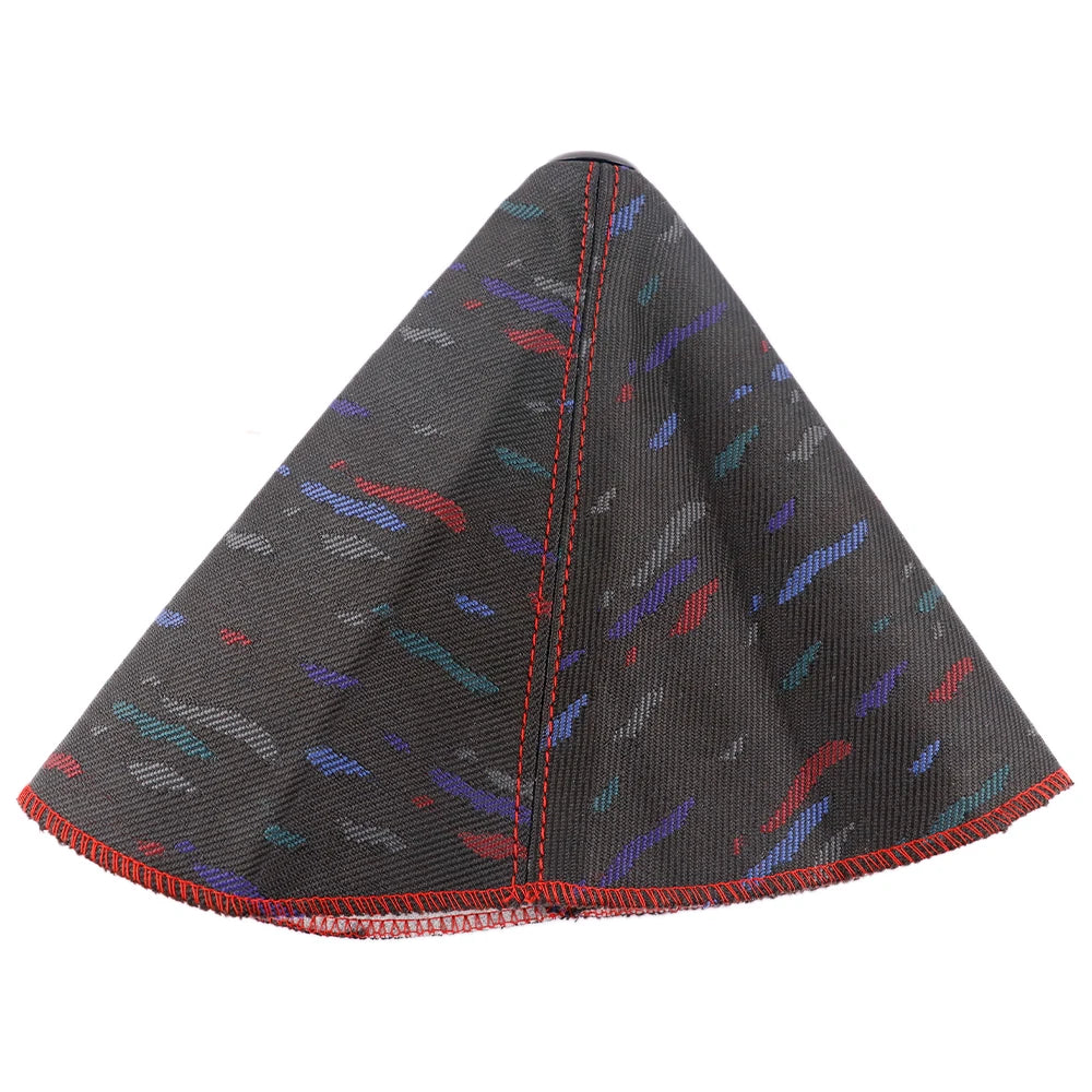 Black gear shift cover with colorful pattern on a white background