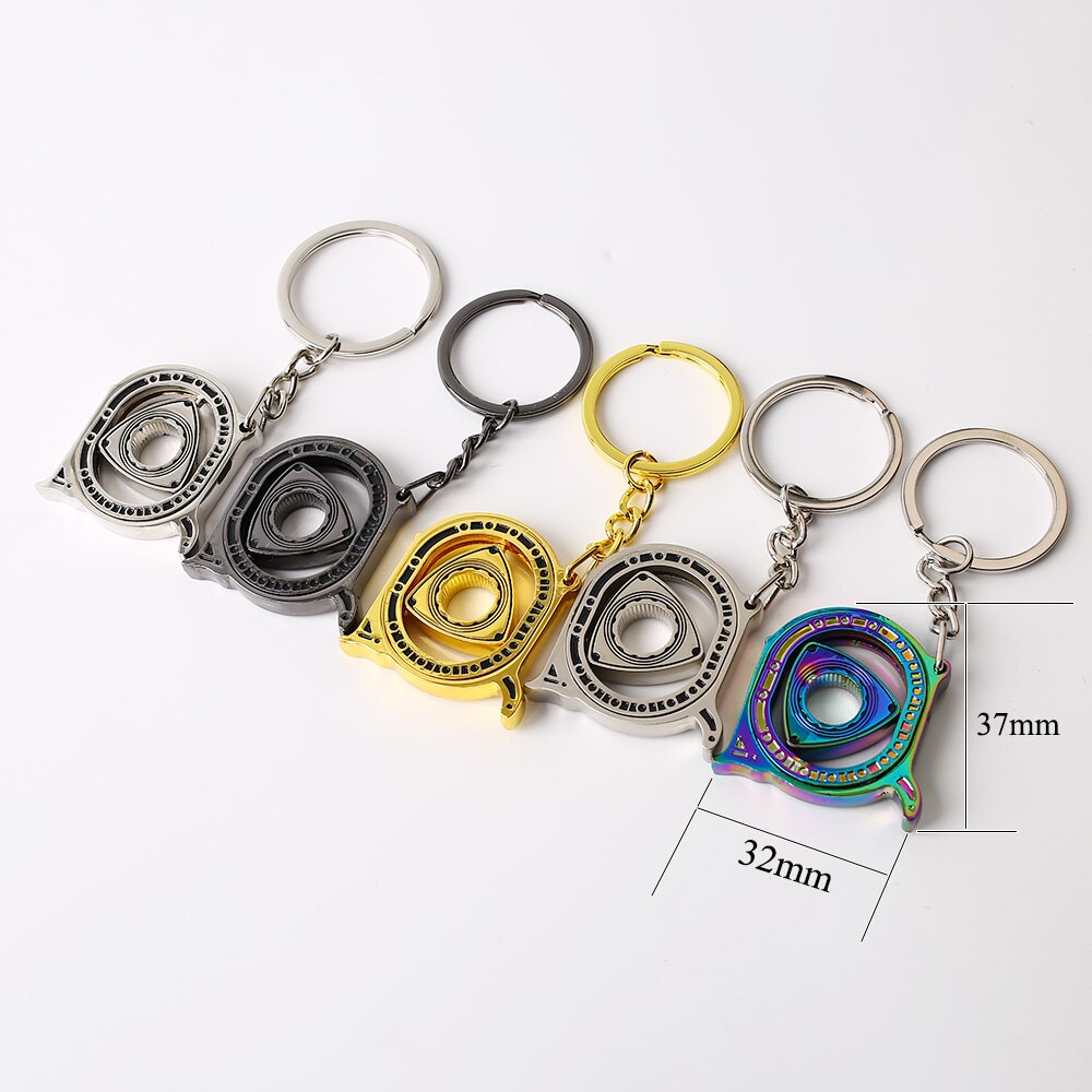 Spinning Rotary Engine Keychain in silver, black, gold, and neochrome.