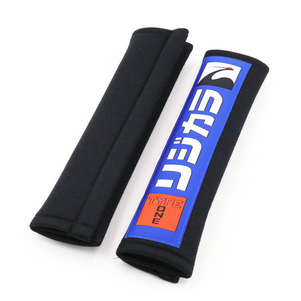 Spoon Sports seat belt shoulder pads in black.