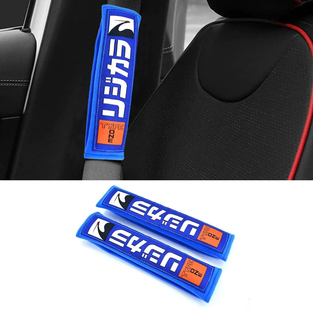 Spoon Sports seat belt shoulder pads in blue installed in car.