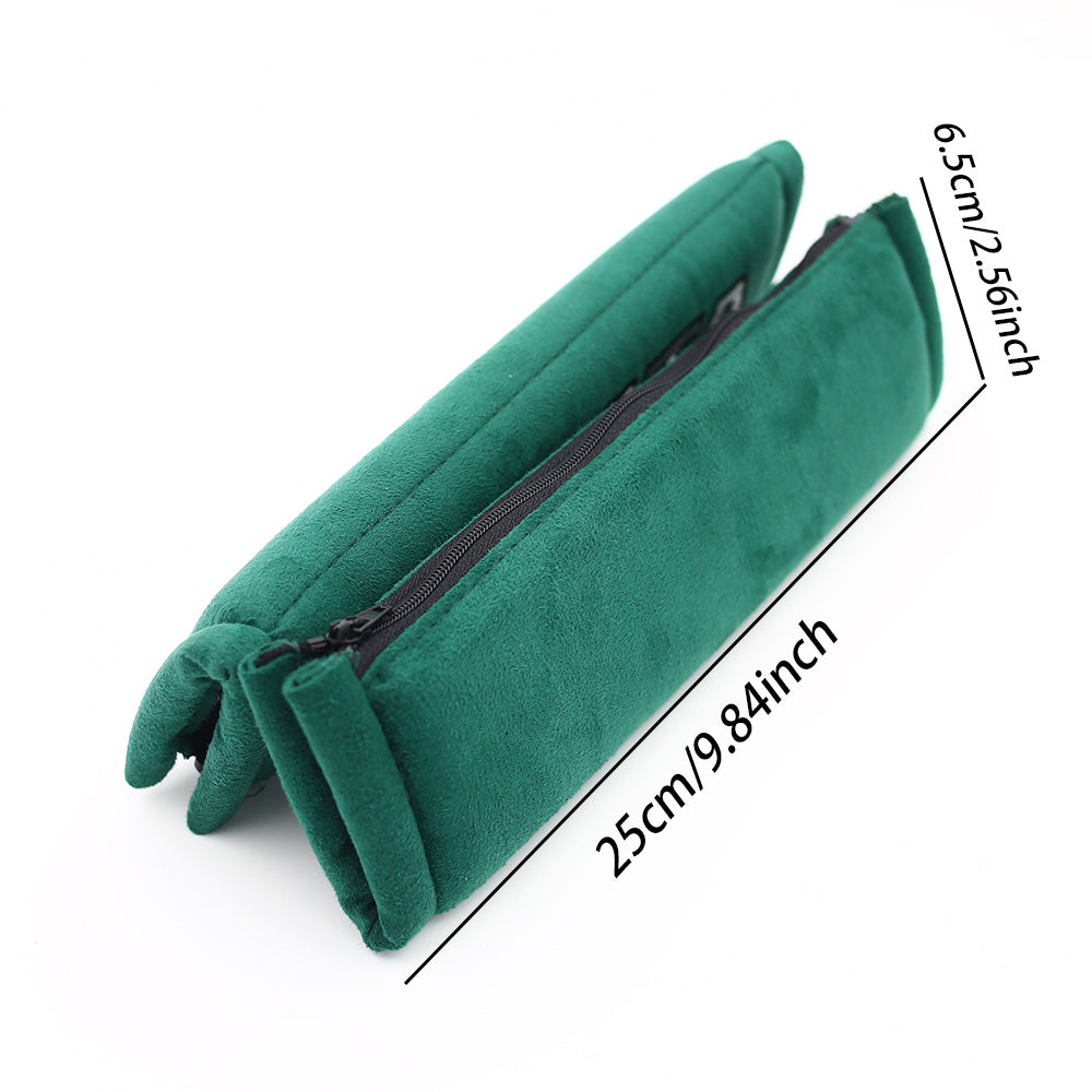 A pair of takata comfort seat belt shoulder pads in green.