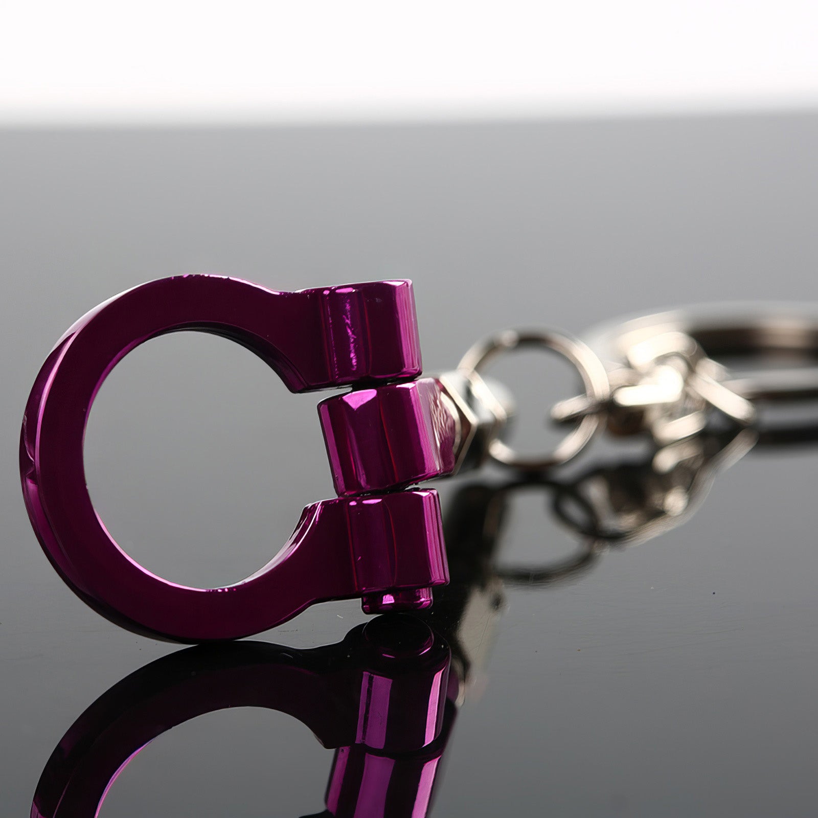 Tow hook keychain with purple hook.