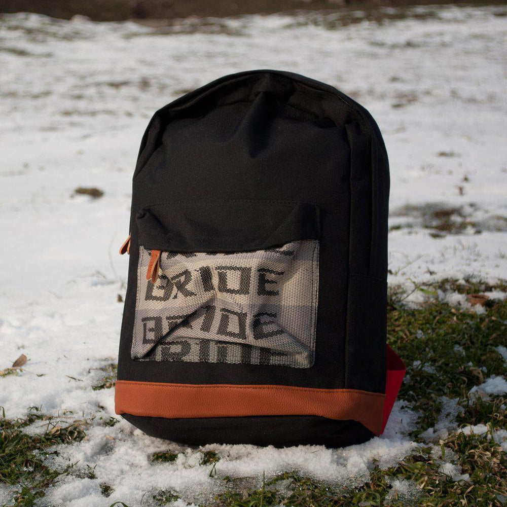JDM Backpack with red racing harness straps and brown leather bottom