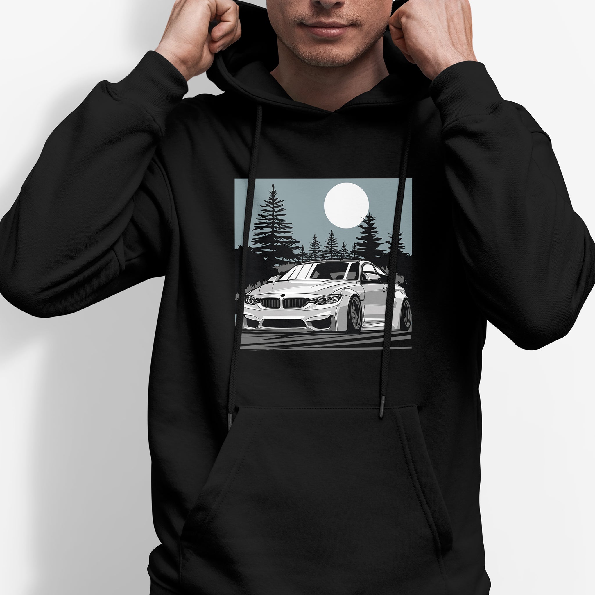 Man wearing BMW M4 Car Hoodie in black.