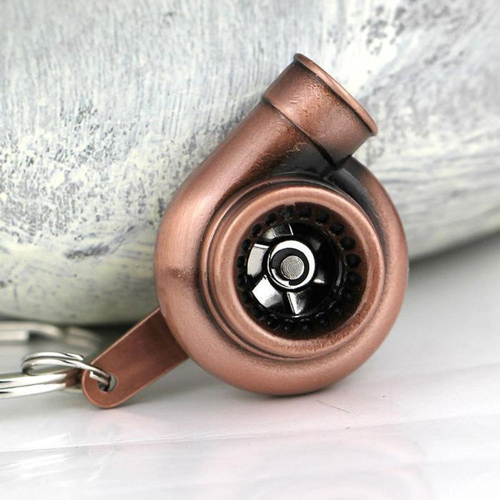 Turbocharger car keychain in copper color.