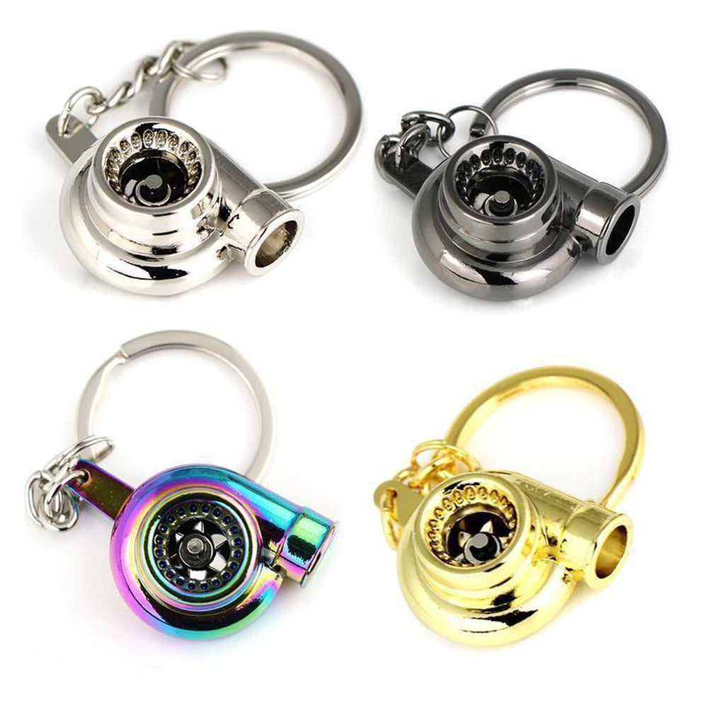 Turbocharger car keychains in silver, neochrome, black, and gold.