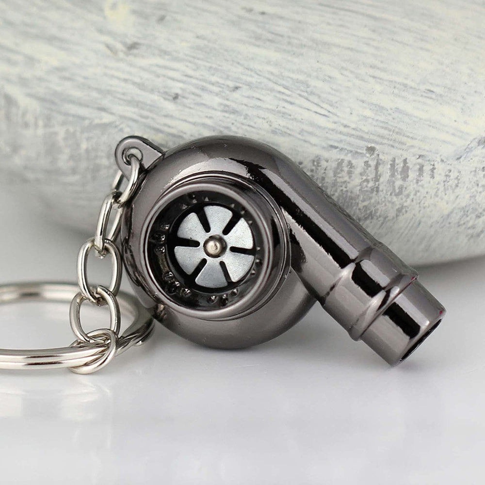 Turbocharger whistle car keychain in black.