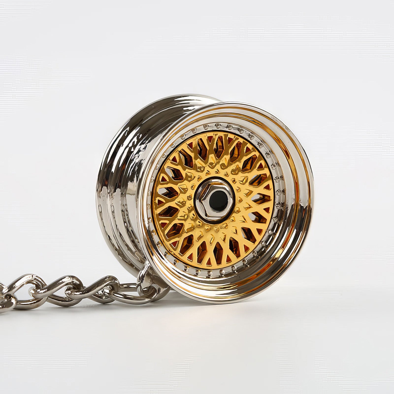 BBS Mesh Wheel keychain with gold center.