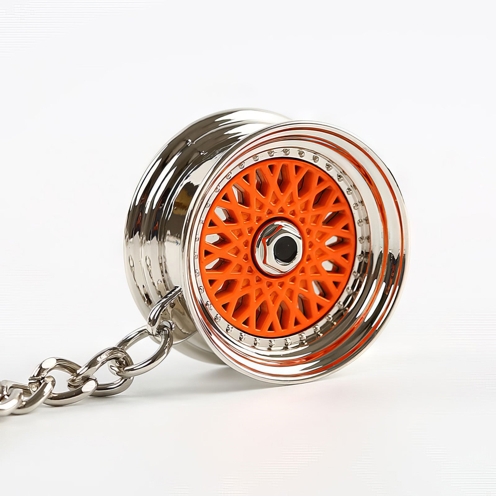 BBS Mesh Wheel keychain with orange center.