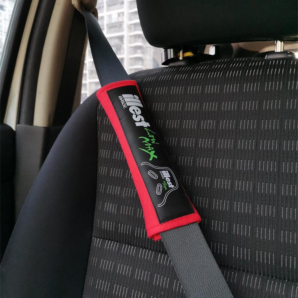 Bride illest JDM seat belt shoulder pads in red installed in car.