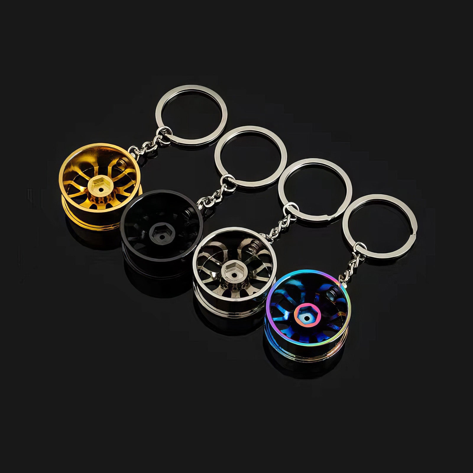 Concave wheel keychain in neochrome, black, silver, and gold variants.