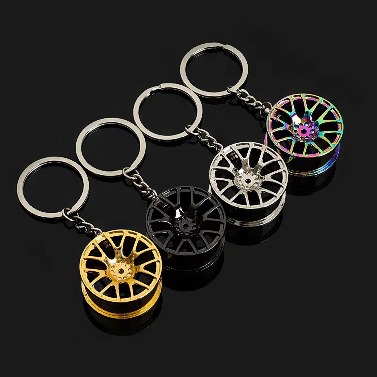 Concave wheel keychain in neochrome, black, silver, and gold variants.