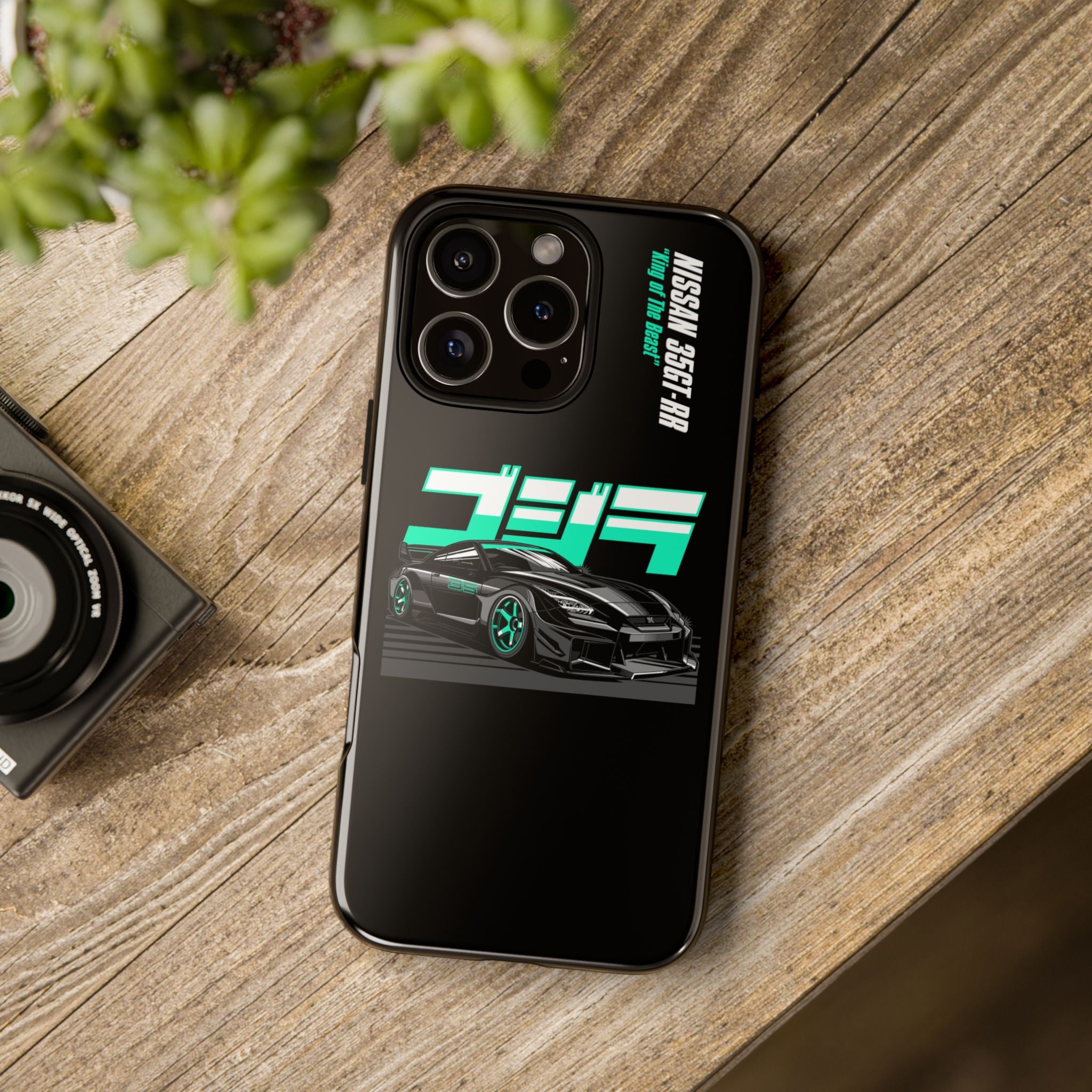 black Phone case with Nissan 35GT-RR design on a wooden surface