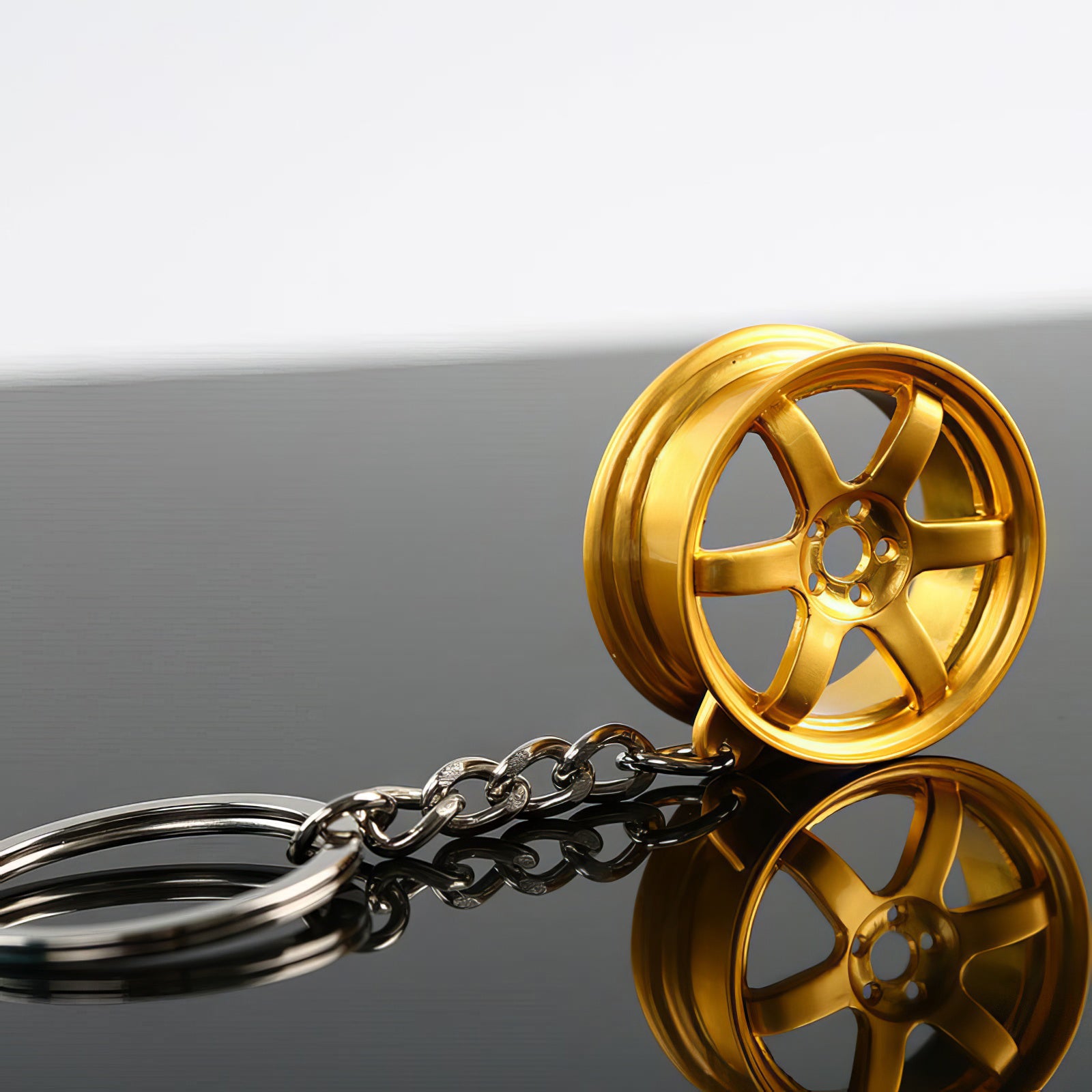RAYS TE37 Wheel Keychain in gold.