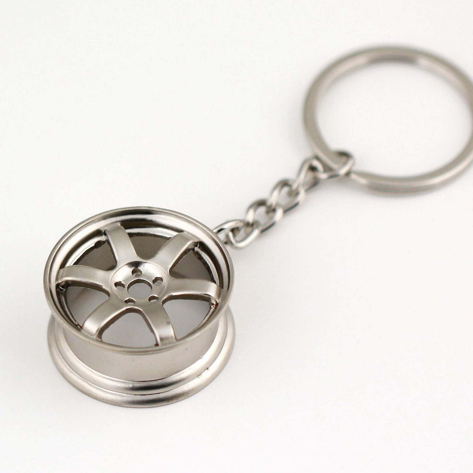 RAYS TE37 Wheel Keychain in silver.