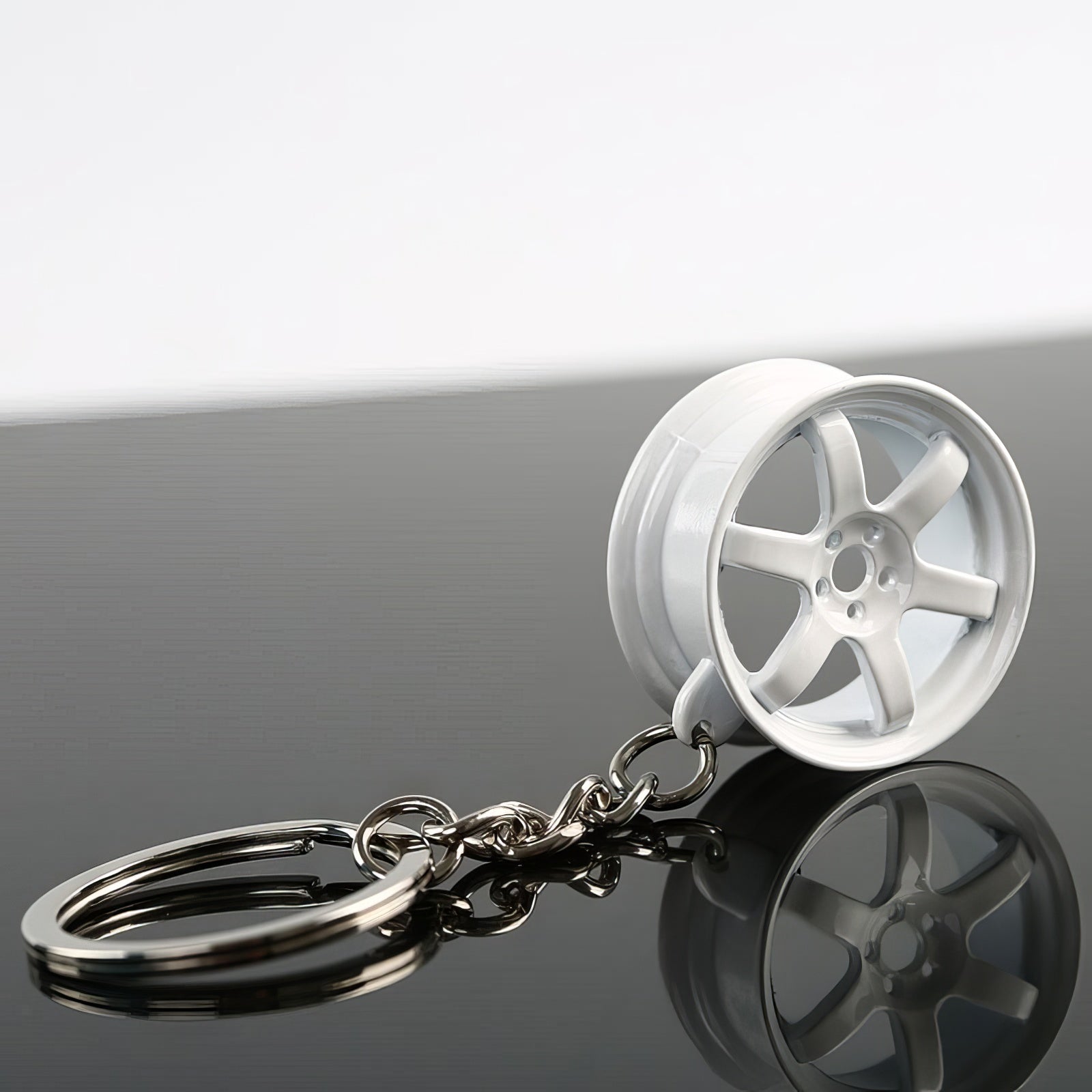 RAYS TE37 Wheel Keychain in white.