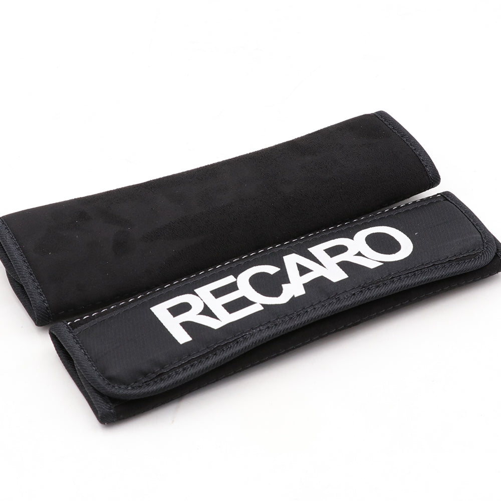 A pair of Recaro comfort seat belt shoulder pads in black.