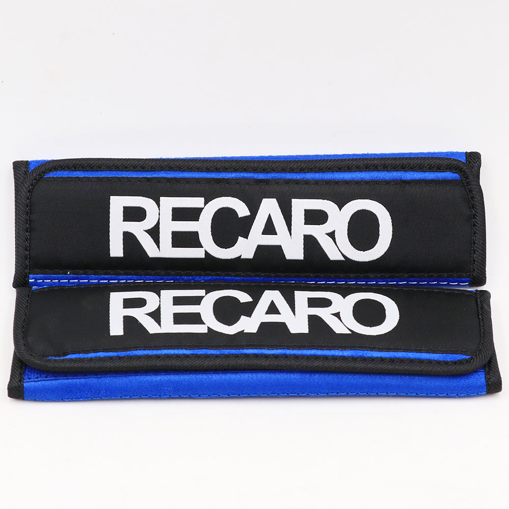 A pair of Recaro comfort seat belt shoulder pads in blue.