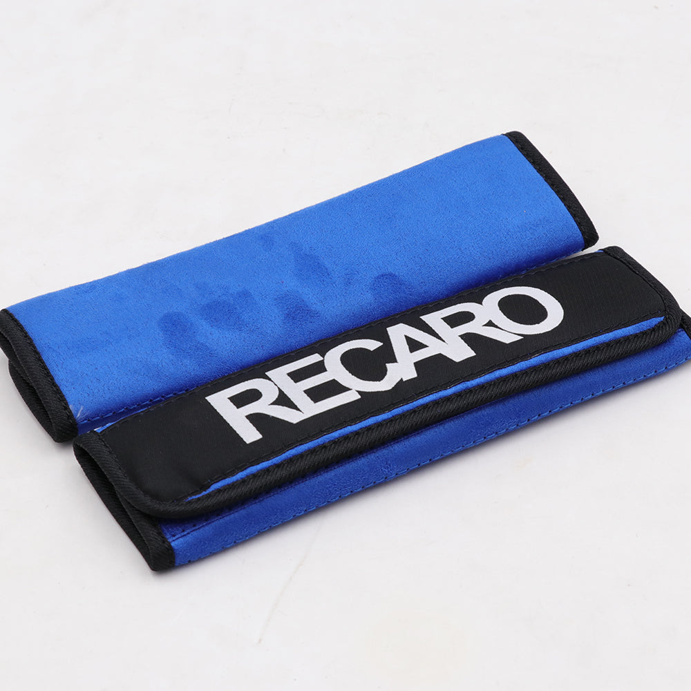 A pair of Recaro comfort seat belt shoulder pads in blue.
