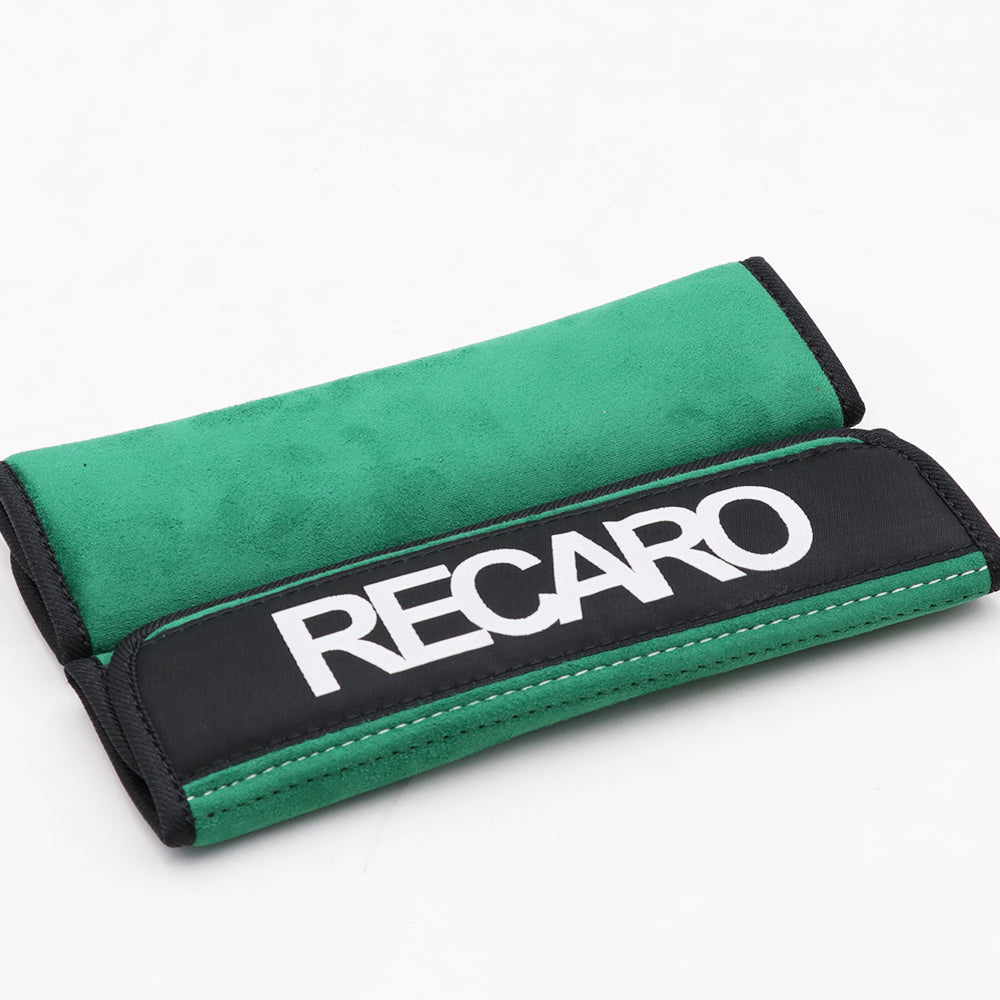 A pair of Recaro comfort seat belt shoulder pads in green.