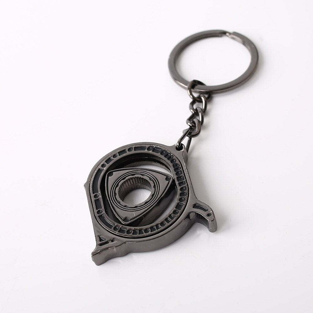 Spinning Rotary Engine Keychain in black.