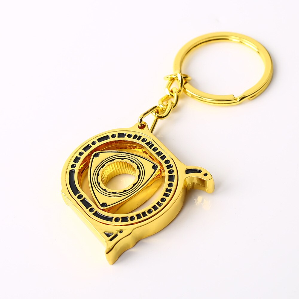 Spinning Rotary Engine Keychain in gold.