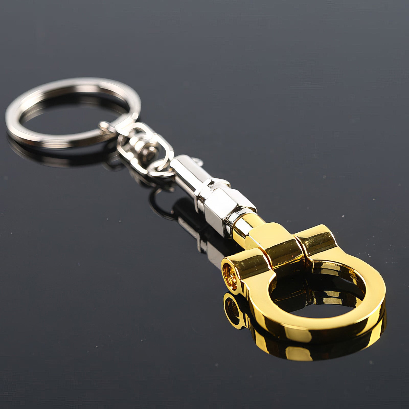 Tow hook keychain with gold hook.