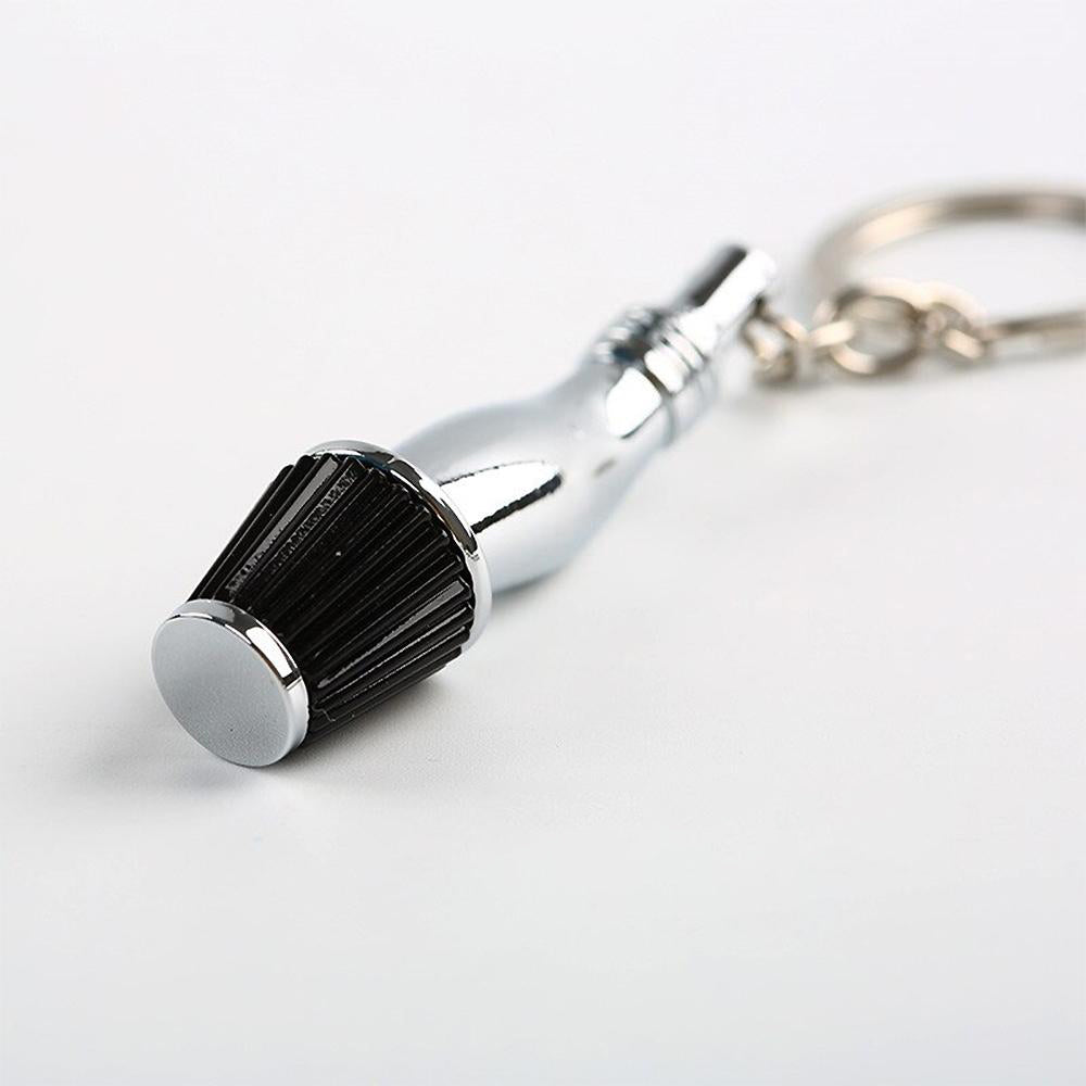 Cold Air Intake Keychain in black.