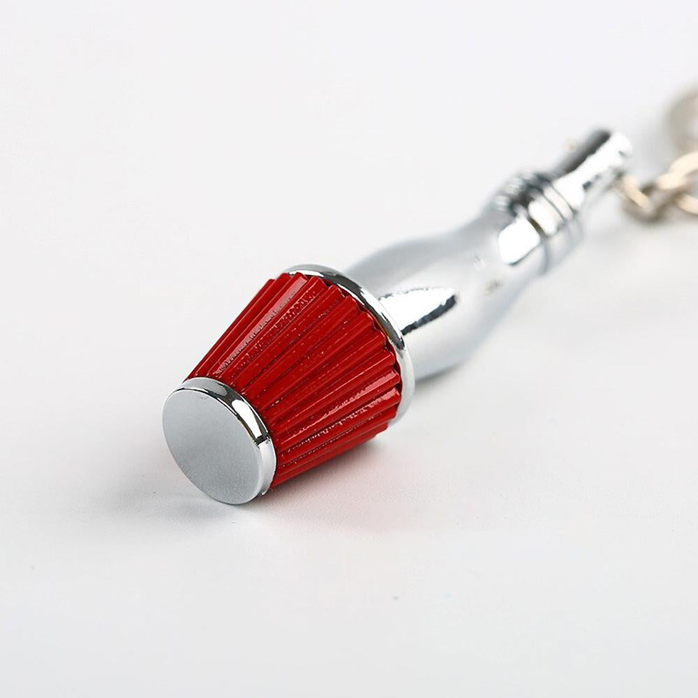 Cold Air Intake Keychain in red.