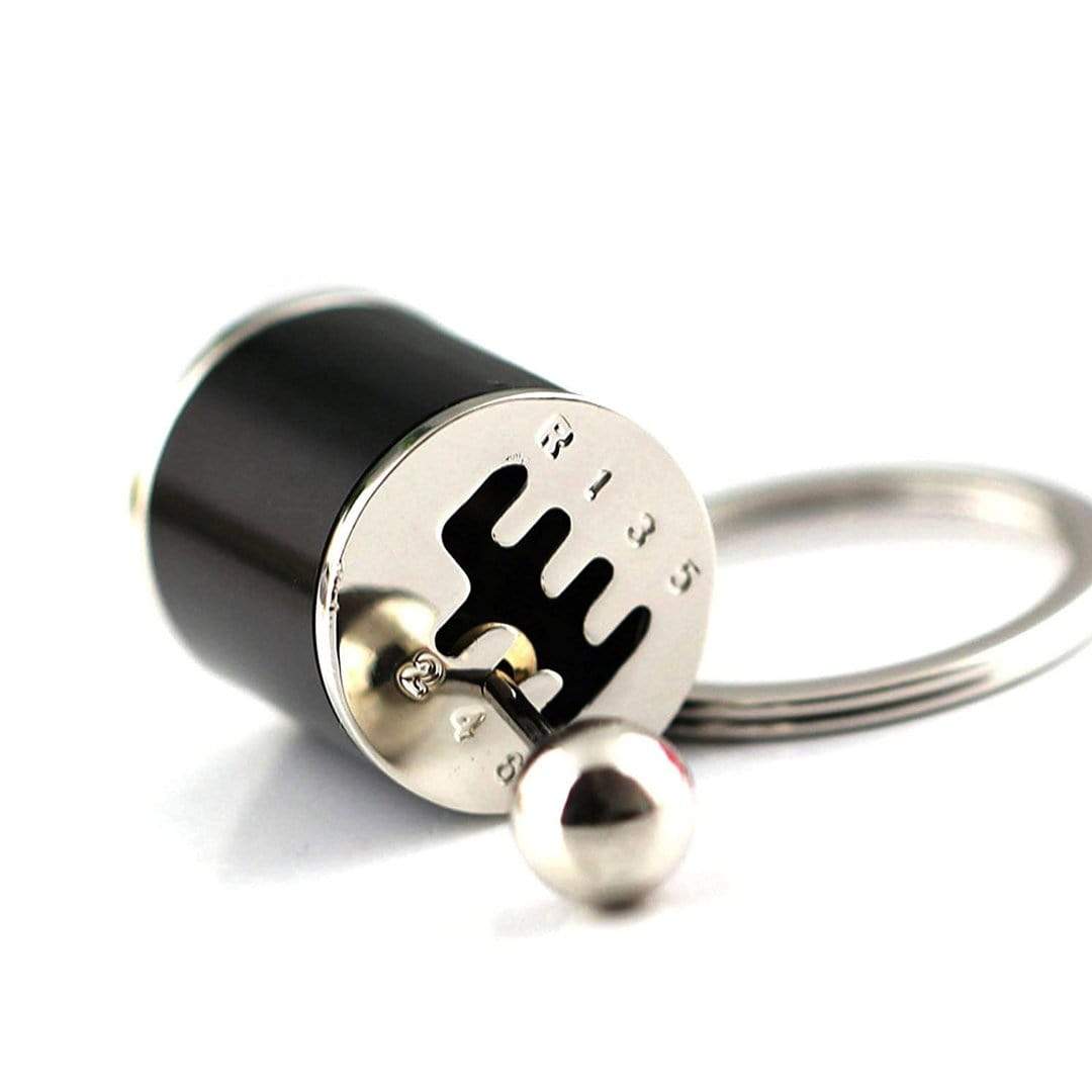 Gear stick shift car keychain in black.