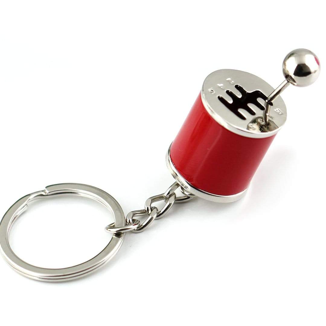 Gear stick shift car keychain in red.