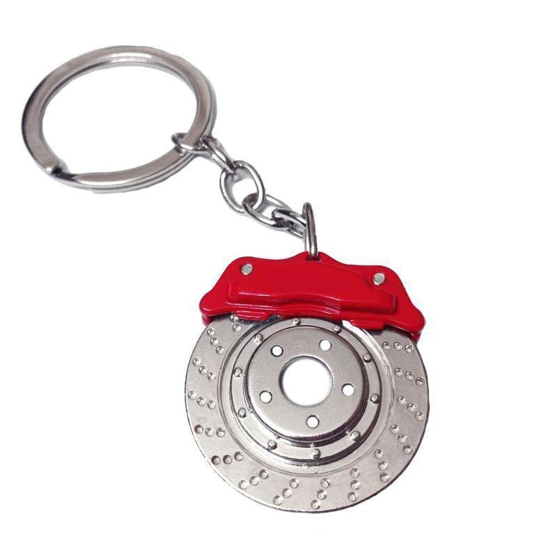 Rotary brake disc car keychain with red caliper.