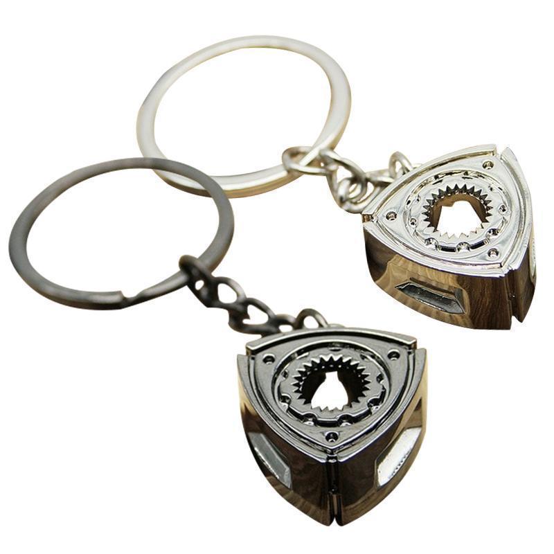 Rotary engine centerpiece car keychains in black and silver.