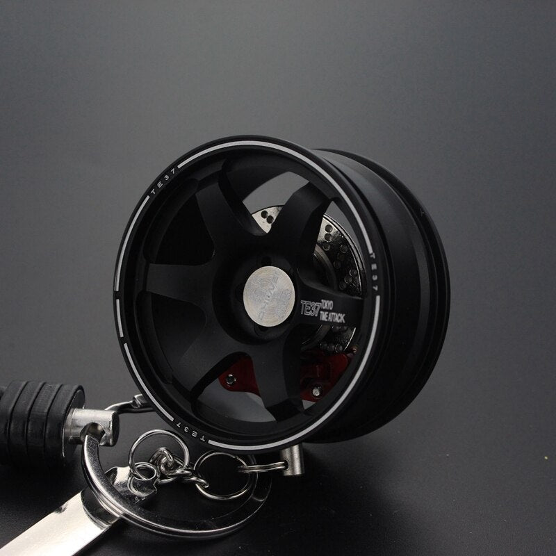 TE37 RAYS wheel with disc brake car keychain in black.