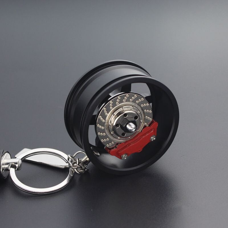Backside of TE37 RAYS wheel with disc brake car keychain in black.