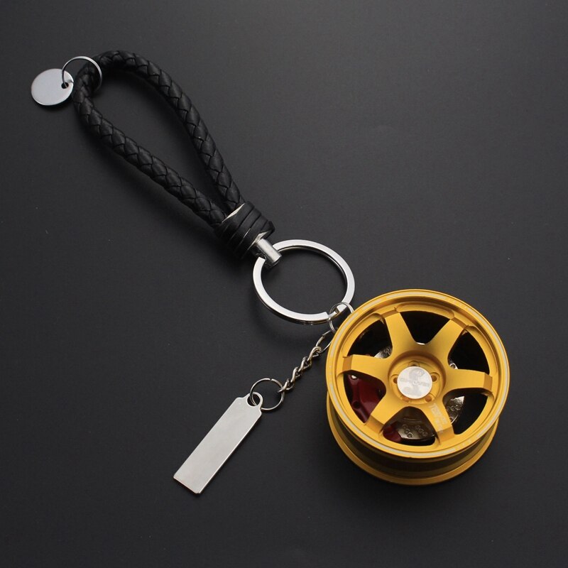 TE37 RAYS wheel with disc brake car keychain in gold.