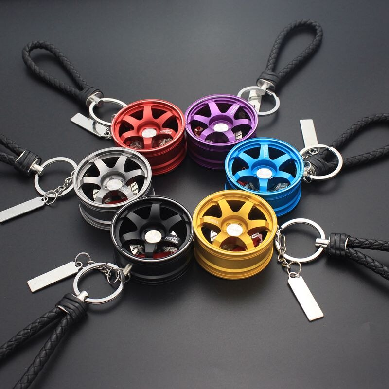 TE37 RAYS wheel with disc brake car keychain in silver, red, purple, black, gold, and blue.