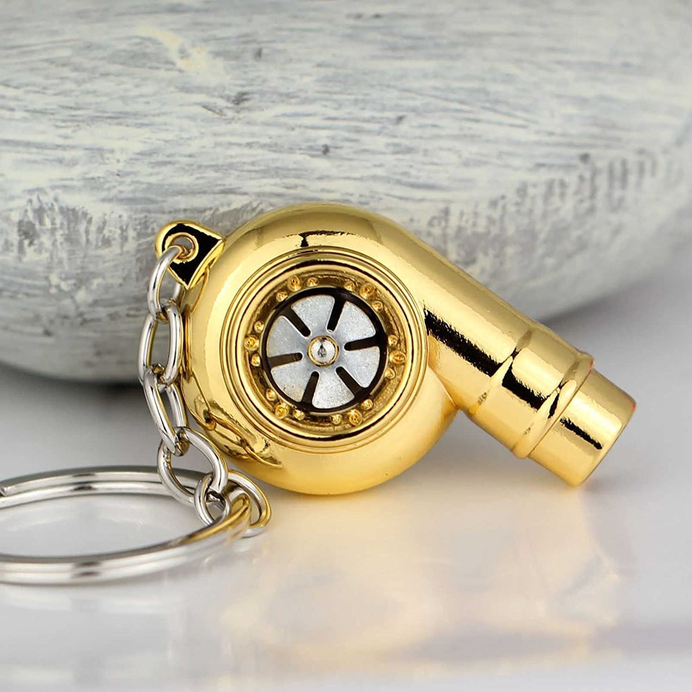 Turbocharger whistle car keychain in gold.